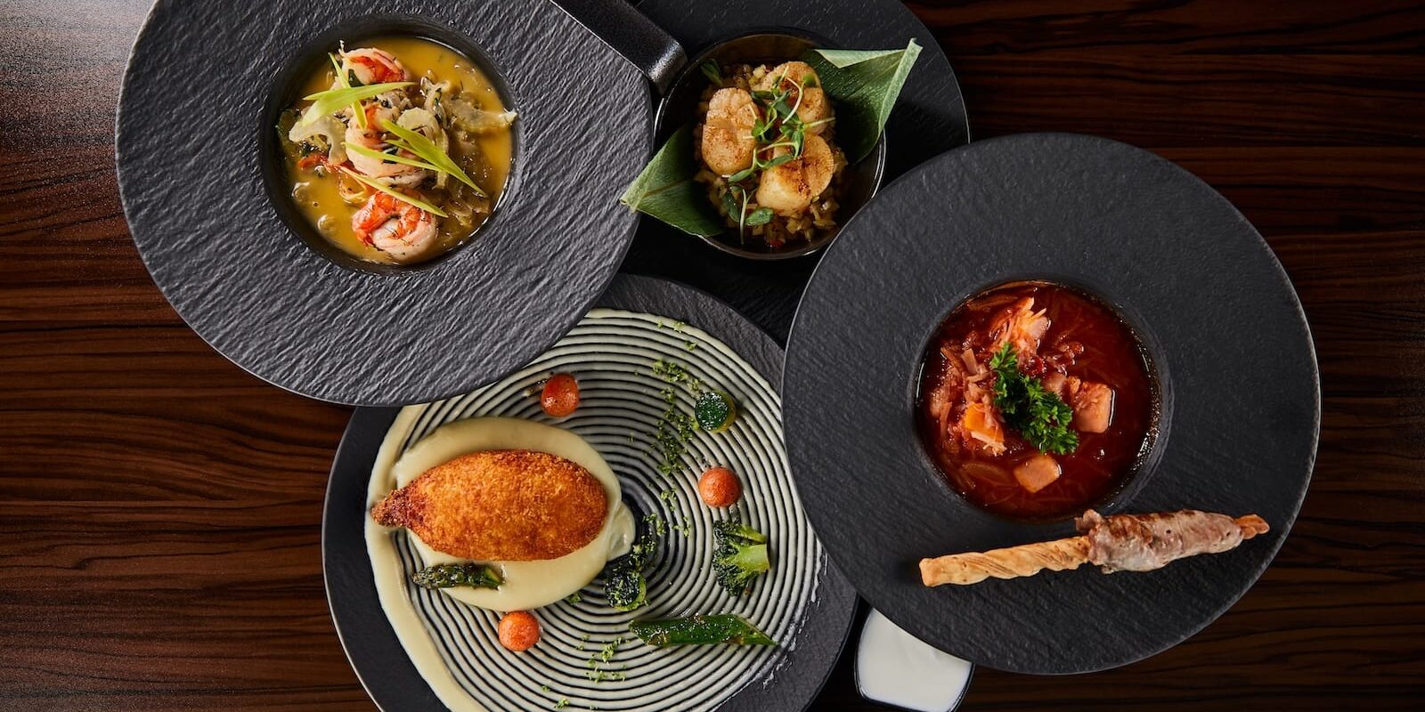 top-view-of-delicious-restaurant-dishes-on-wooden-2022-12-16-18-51-48-utc
